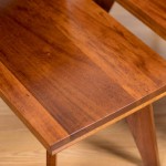 Pair of Hawaii Modern side tables in koa with ape carvings.